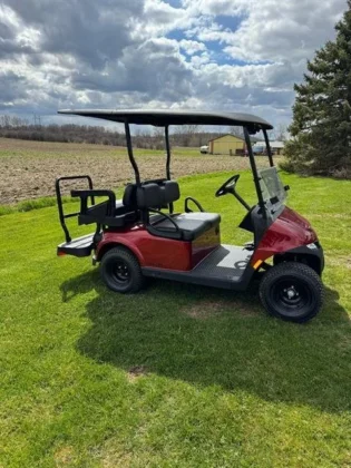 2025 E-Z-GO Valor 4 Electric golf cart in Inferno Red, stock 5879683