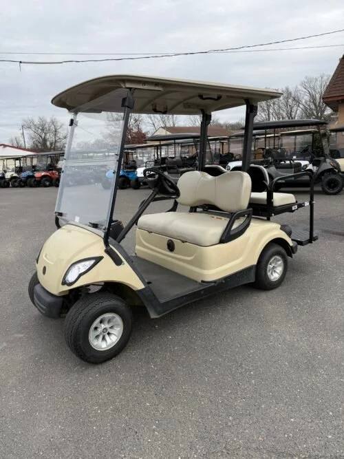EMT-21633-001-IMG_9652-500x667-1.webp 2016 Yamaha Drive 48V Electric golf cart in Sunstone Tan with four seats