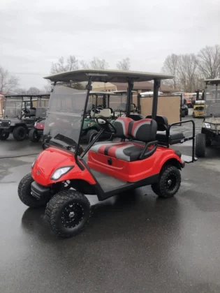 2016 Yamaha Drive lifted electric golf cart in Bright Torch Red