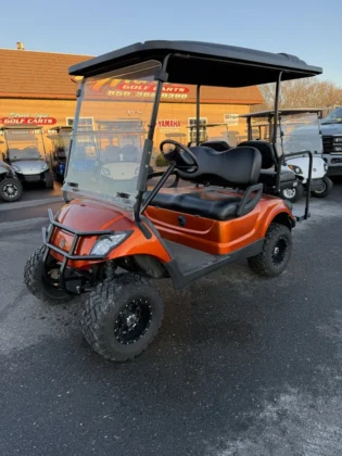 2016 Yamaha Drive lifted electric golf cart in Sunset Candy Orange Metallic