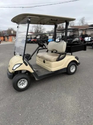 2016 Yamaha 48V Electric utility golf cart in Sunstone Tan with rear utility bin